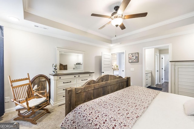 carpeted bedroom featuring ornamental molding, a raised ceiling, ceiling fan, and baseboards