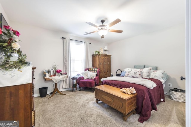 bedroom with light carpet and ceiling fan