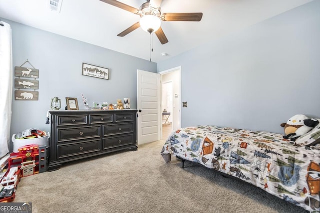 bedroom featuring a ceiling fan, visible vents, and light carpet