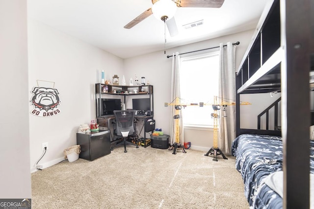 carpeted bedroom with ceiling fan, visible vents, and baseboards