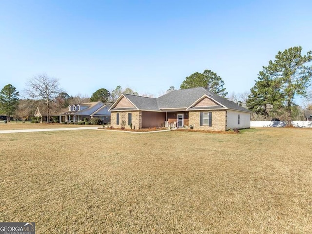 ranch-style house featuring a front lawn