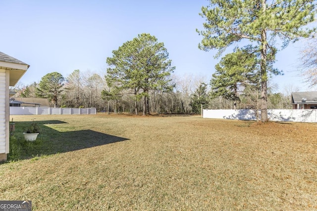 view of yard featuring fence