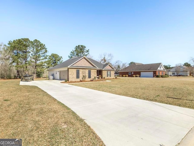 view of front of house with a garage, concrete driveway, and a front yard