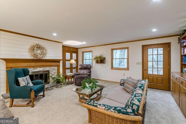 living room with recessed lighting, a fireplace, crown molding, and light colored carpet