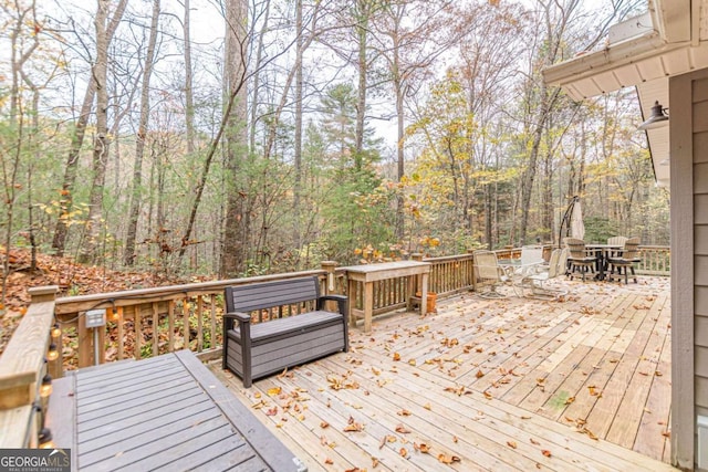 deck with outdoor dining area