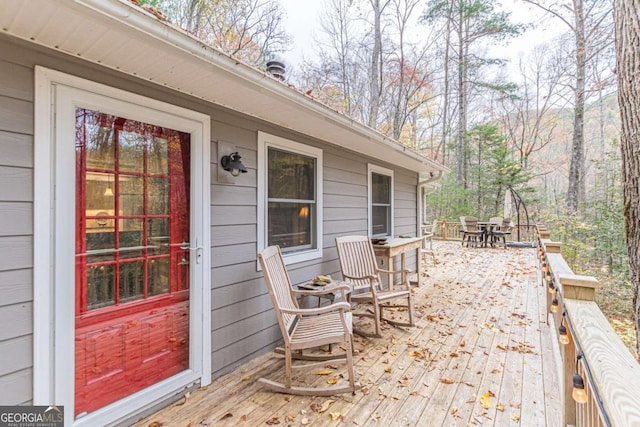 deck featuring outdoor dining area