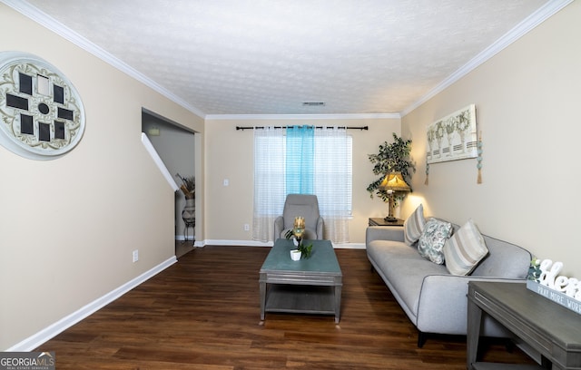 living area with crown molding, visible vents, a textured ceiling, wood finished floors, and baseboards