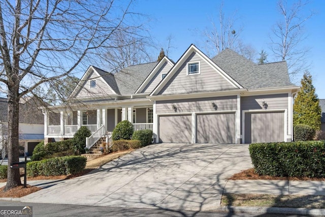 view of front of home featuring a porch, roof with shingles, driveway, and an attached garage