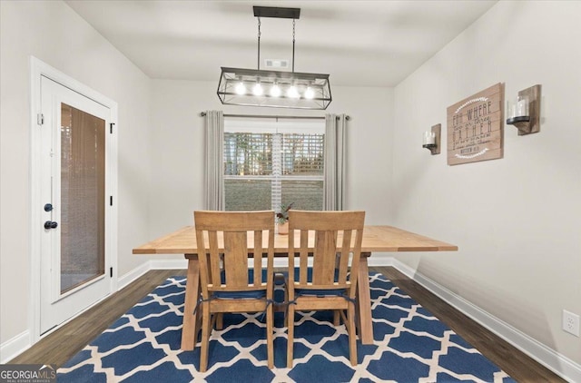 dining room with wood finished floors and baseboards