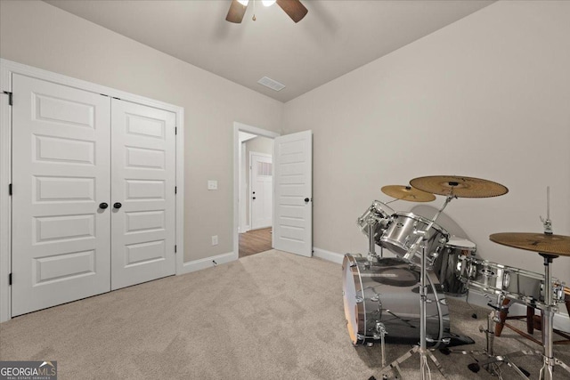 rec room with visible vents, baseboards, a ceiling fan, carpet, and vaulted ceiling