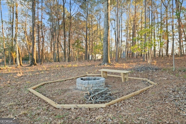 view of yard with an outdoor fire pit