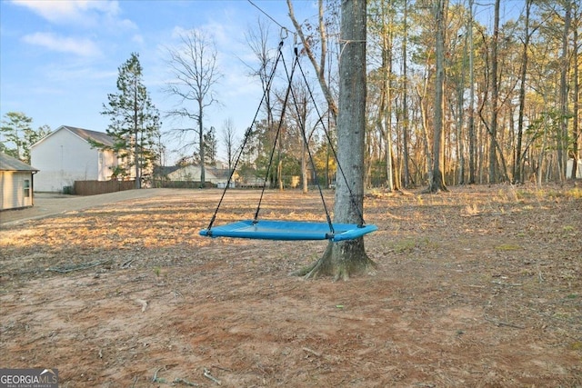 view of yard with a trampoline