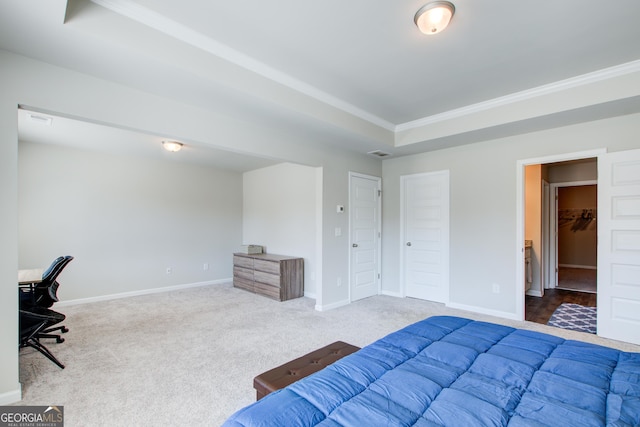 bedroom featuring visible vents, baseboards, a raised ceiling, crown molding, and carpet floors