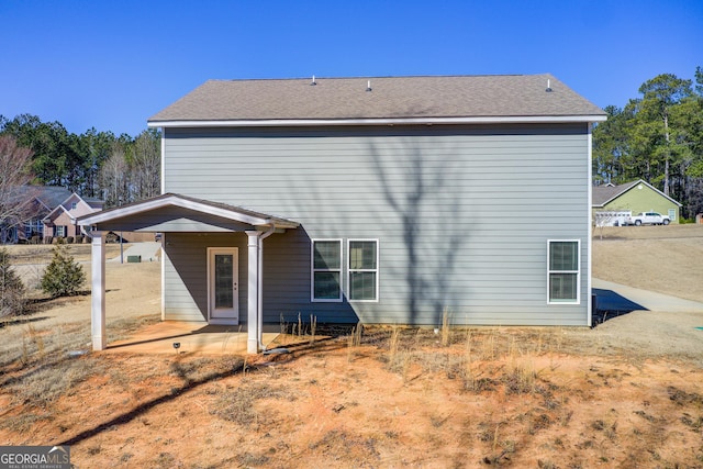 back of property with a patio area