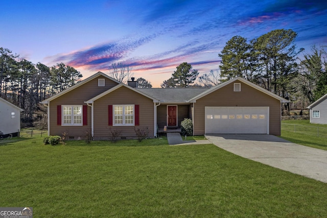 ranch-style house with a garage, driveway, a lawn, and fence