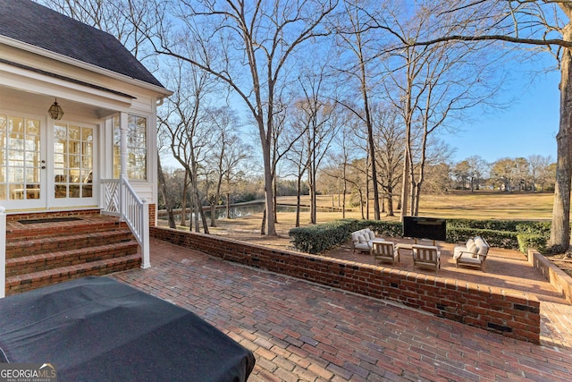 view of patio / terrace with entry steps and french doors