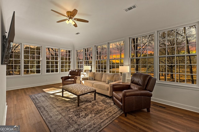 sunroom with ceiling fan and visible vents