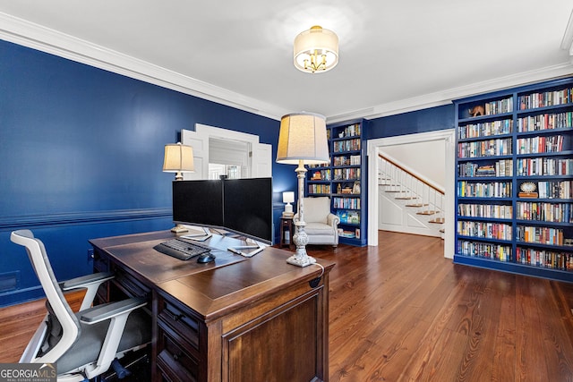 home office with dark wood-style flooring, built in features, and crown molding