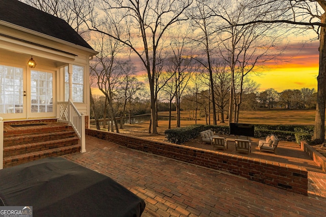 patio terrace at dusk with entry steps and french doors