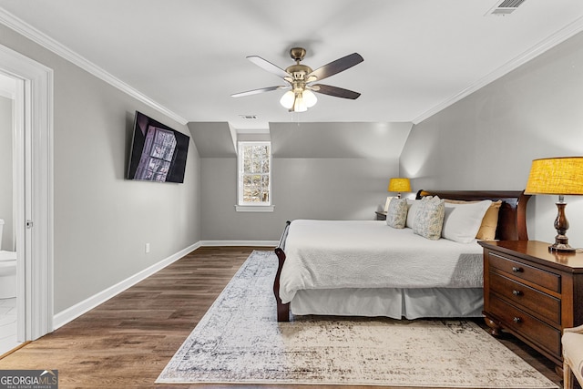 bedroom with ornamental molding, visible vents, baseboards, and wood finished floors
