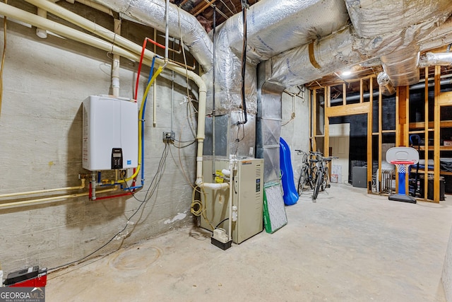 utility room with tankless water heater and heating unit