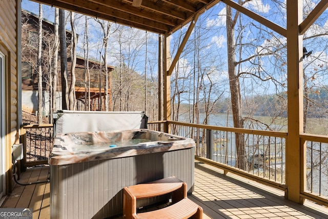 wooden terrace featuring a hot tub