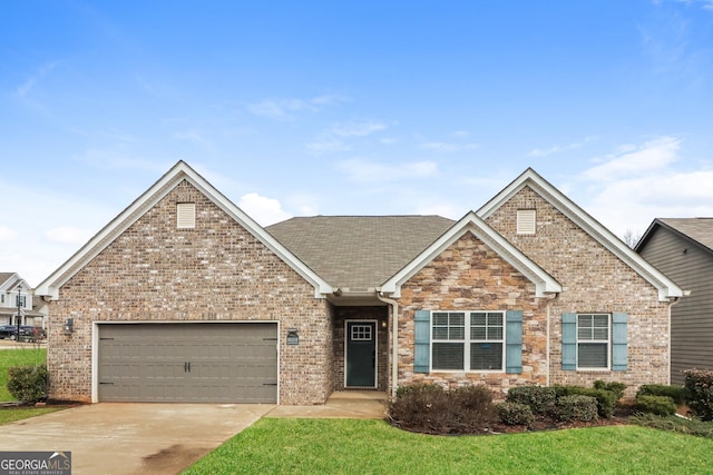 view of front of property featuring driveway, a garage, stone siding, a front lawn, and brick siding