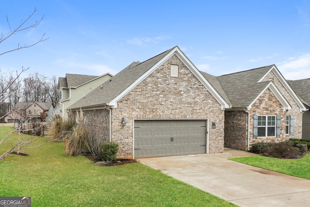 view of front of home featuring a garage, brick siding, driveway, and a front lawn