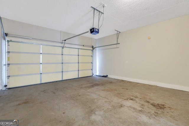 garage featuring baseboards and a garage door opener