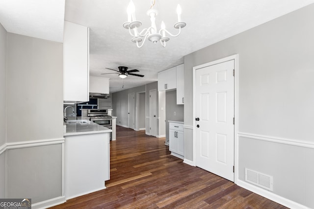 kitchen with visible vents, light countertops, and white cabinetry