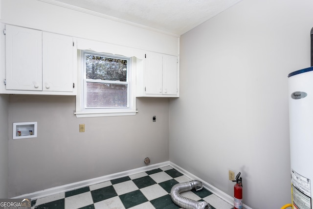 laundry area featuring cabinet space, baseboards, dark floors, hookup for a washing machine, and hookup for an electric dryer