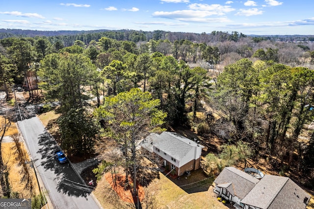 aerial view featuring a forest view