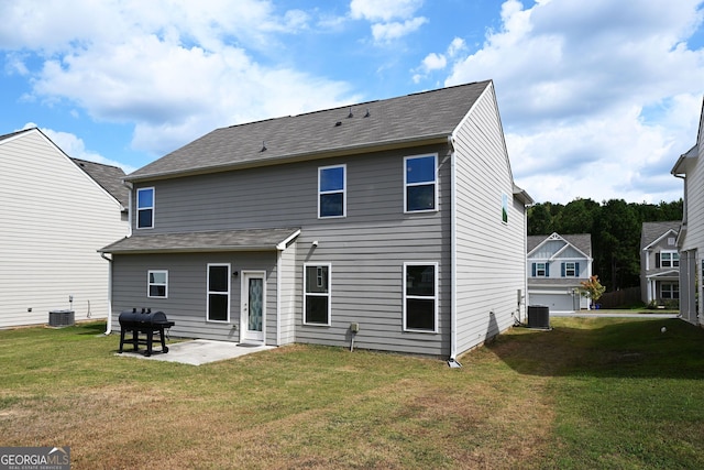 rear view of house featuring cooling unit, a patio area, and a yard