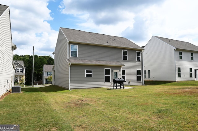 back of house with a patio area, central AC unit, and a yard