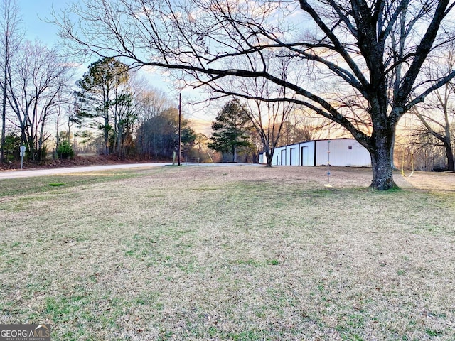 view of yard with an outbuilding and a pole building