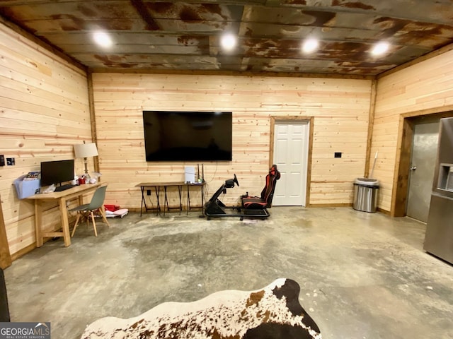 garage featuring wood walls