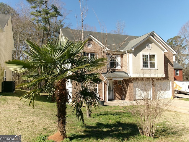 view of front of property featuring concrete driveway, central AC, a front yard, and stucco siding