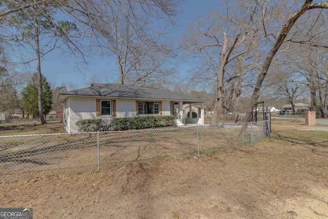 view of front of home with a fenced front yard and a front yard