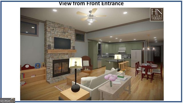 living room with recessed lighting, ornamental molding, light wood-style floors, a ceiling fan, and a stone fireplace