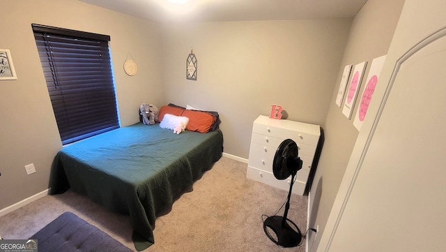 bedroom with carpet flooring and baseboards