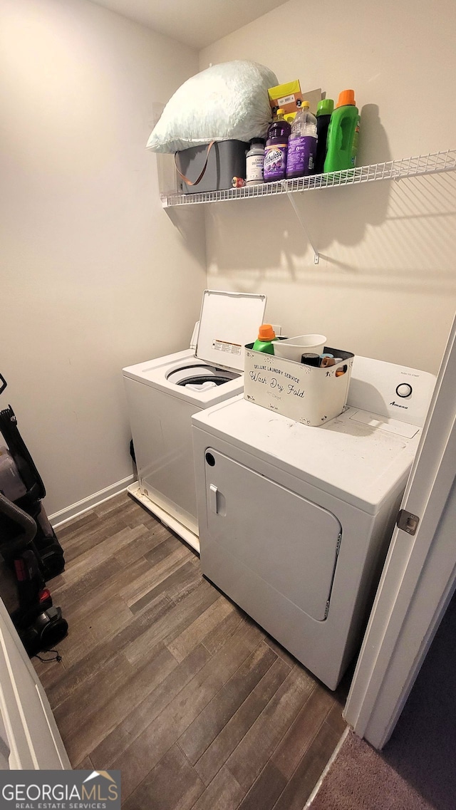 laundry area with laundry area, dark wood-type flooring, and independent washer and dryer