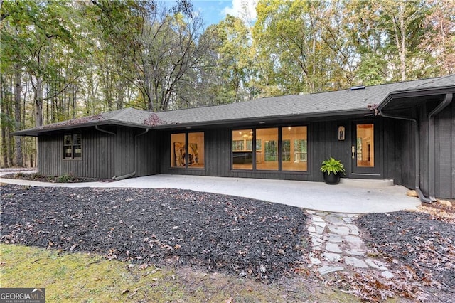 back of house with a patio area