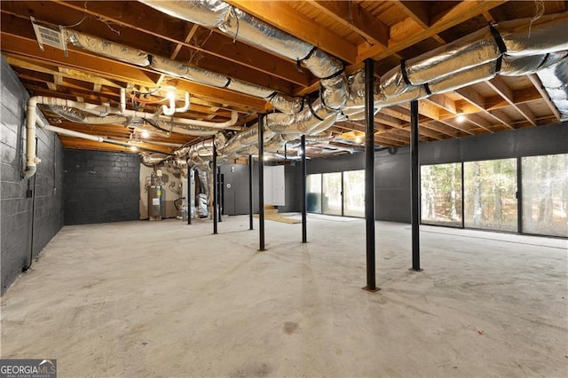 below grade area featuring electric water heater