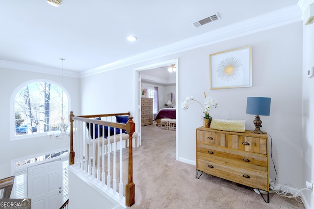 bedroom featuring light carpet, baseboards, visible vents, and crown molding