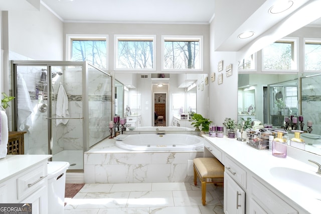 full bath featuring marble finish floor, ornamental molding, a garden tub, and a marble finish shower