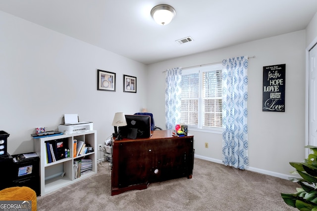 office area with light carpet, visible vents, and baseboards