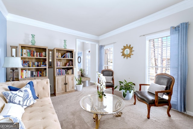 sitting room featuring ornamental molding, a wealth of natural light, and light colored carpet