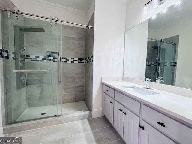 bathroom featuring a shower stall, ornamental molding, and vanity