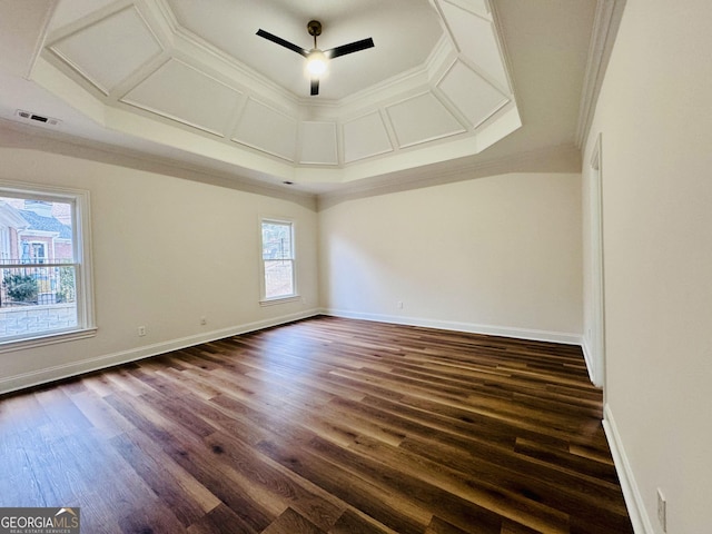 unfurnished room featuring ornamental molding, dark wood-style flooring, a ceiling fan, and baseboards