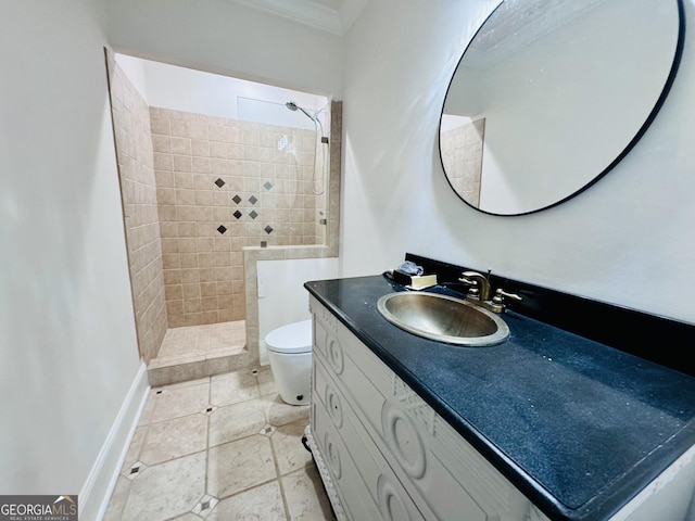 full bath with toilet, baseboards, walk in shower, and vanity